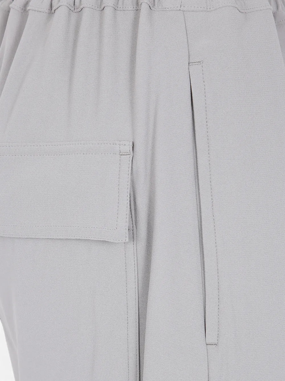 Close up of Grey pants, showing texture of the 53% fsc viscose/ 47% acetate made in fabric