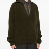 Green shirt worn by a person, showing the shirt fit