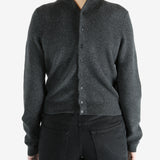 Grey cardigan worn by a person, showing the cardigan fit