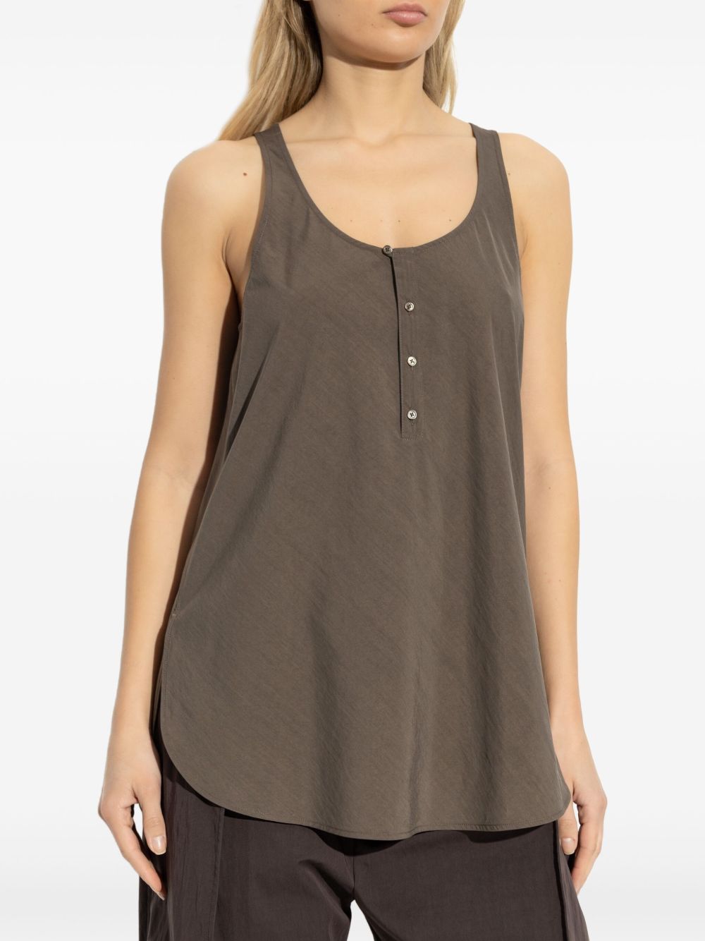 Brown top worn by a person, showing the top fit