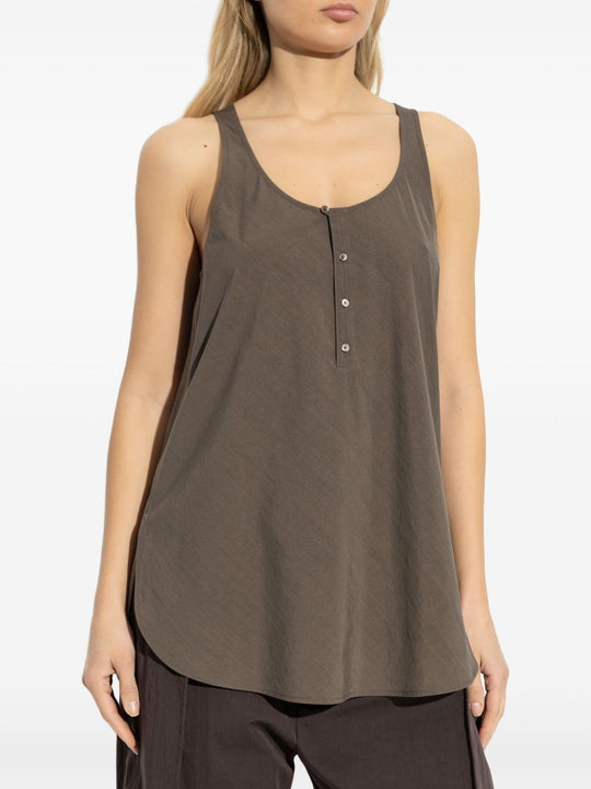 Brown top worn by a person, showing the top fit