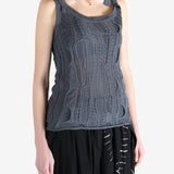 Blue tops worn by a person, showing the tops fit