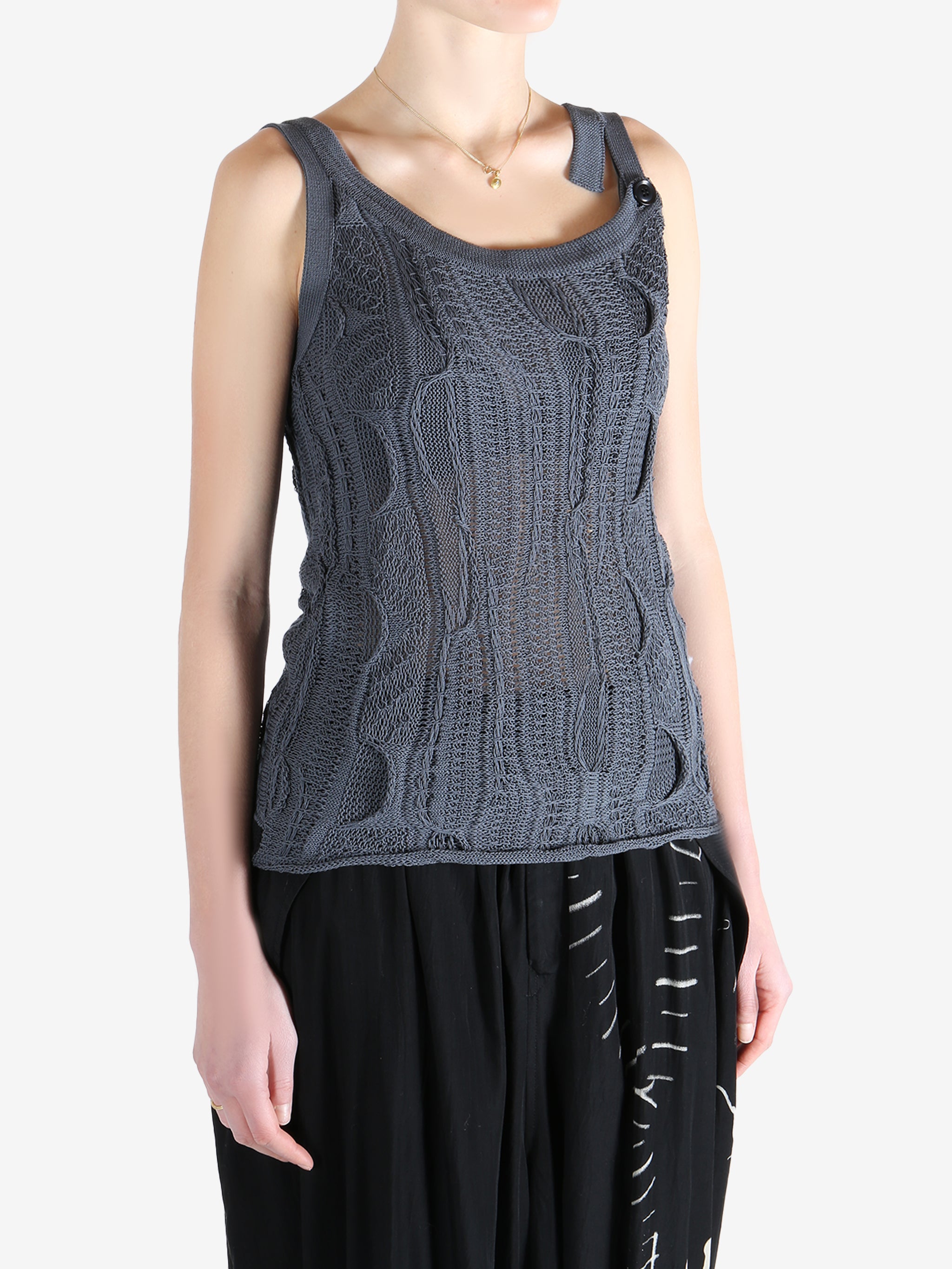 Blue tops worn by a person, showing the tops fit