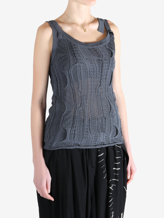 Blue tops worn by a person, showing the tops fit