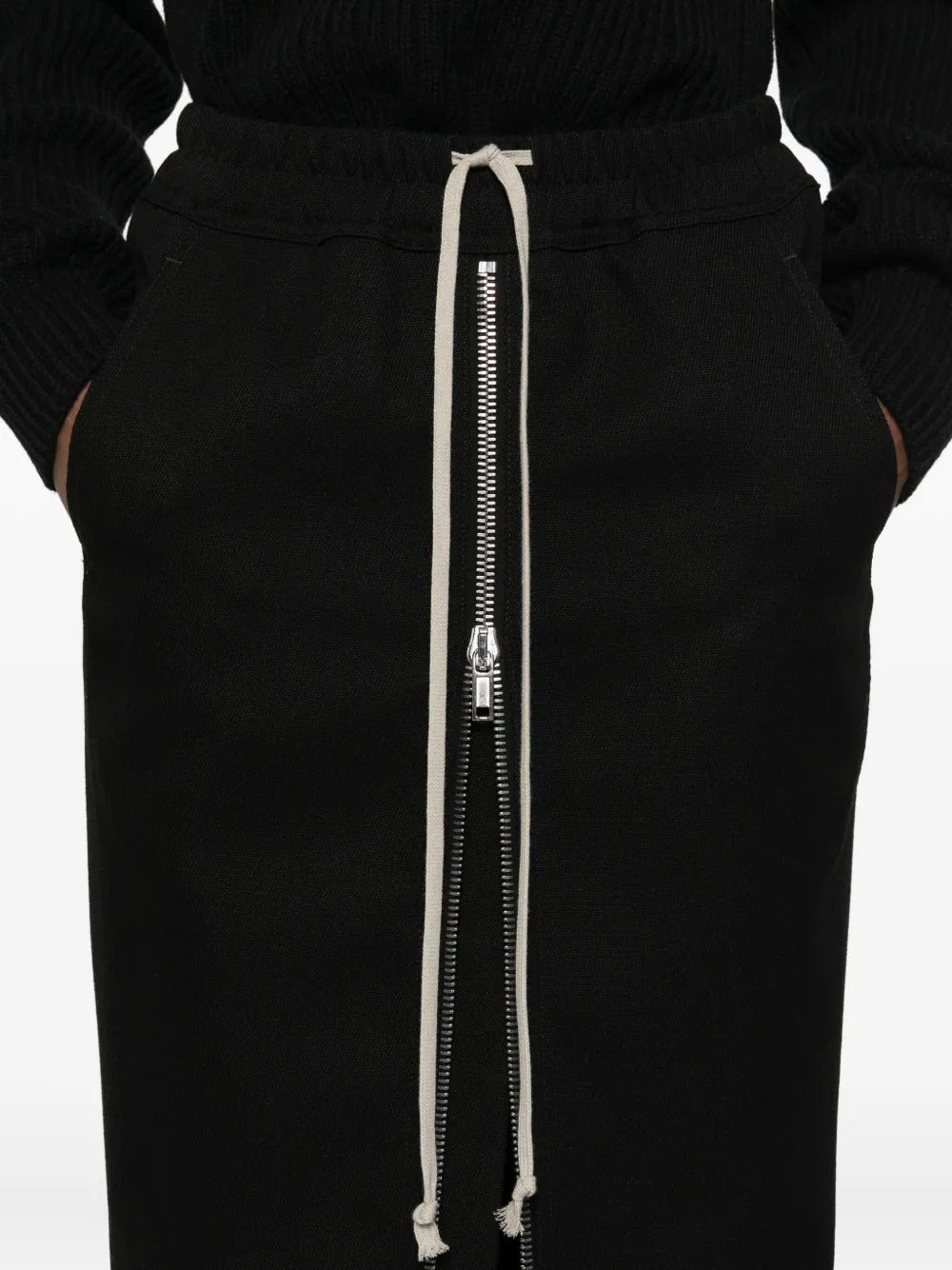 Close up of black skirt, showing texture of the wool fabric