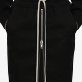 Close up of black skirt, showing texture of the wool fabric