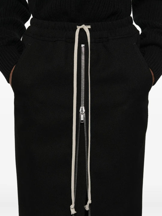 Close up of black skirt, showing texture of the wool fabric