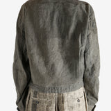 Green jacket worn by a person, showing the jacket fit