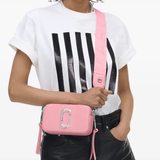 pink bags worn by a person, showing the bags fit