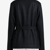 Black jacket worn by a person, showing the jacket fit