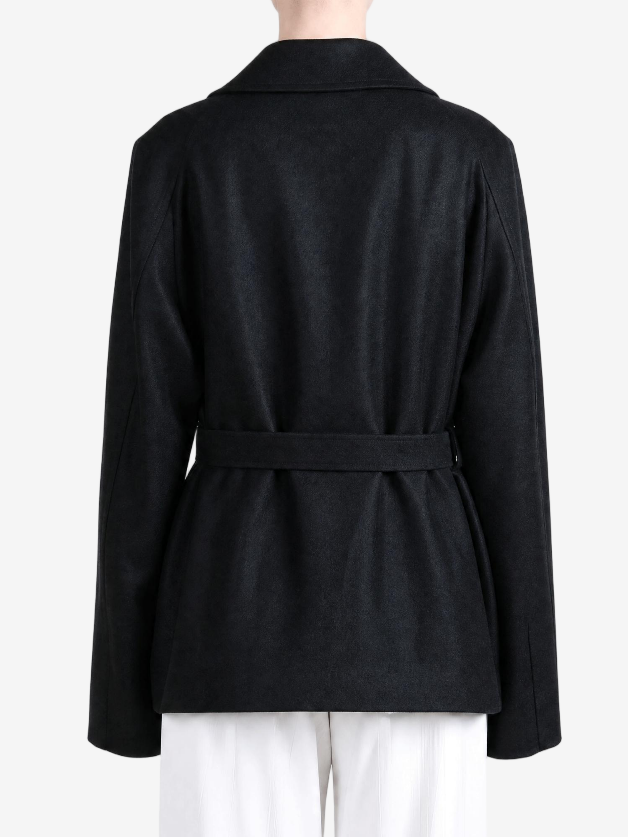 Black jacket worn by a person, showing the jacket fit