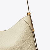 Close up of white bag, showing texture of the leather fabric