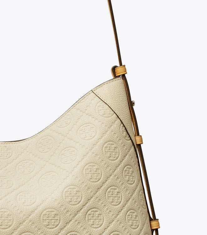 Close up of white bag, showing texture of the leather fabric