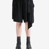 Black shorts worn by a person, showing the shorts's fit