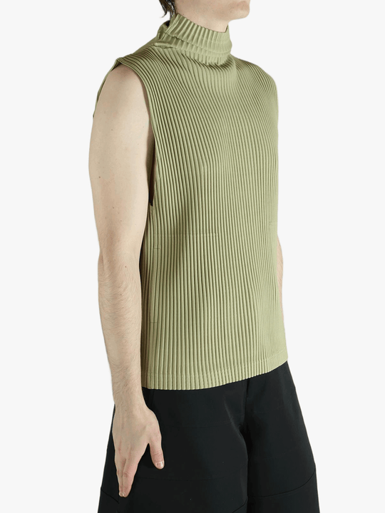 Green top worn by a person, showing the top's fit
