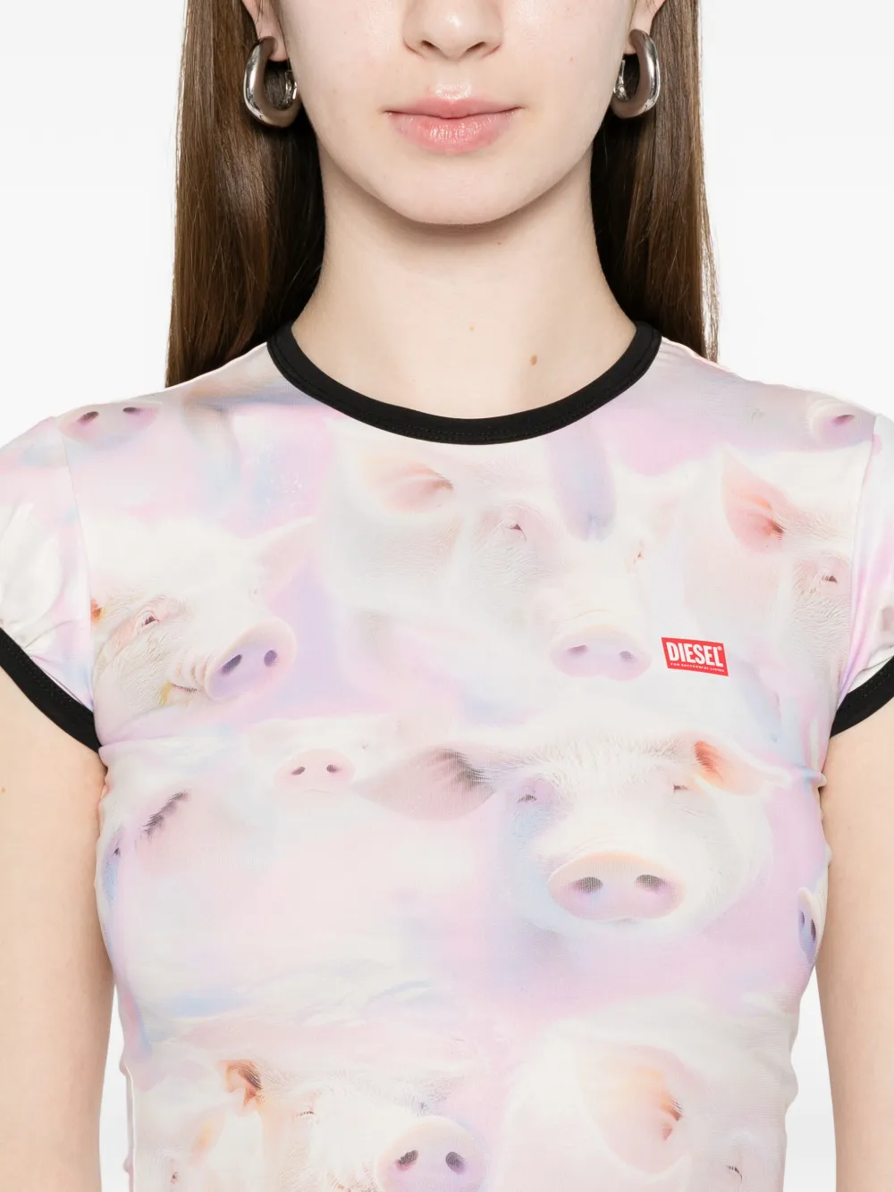 Purple top worn by a person, showing the top's fit