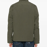 Green jacket worn by a person, showing the jacket's fit