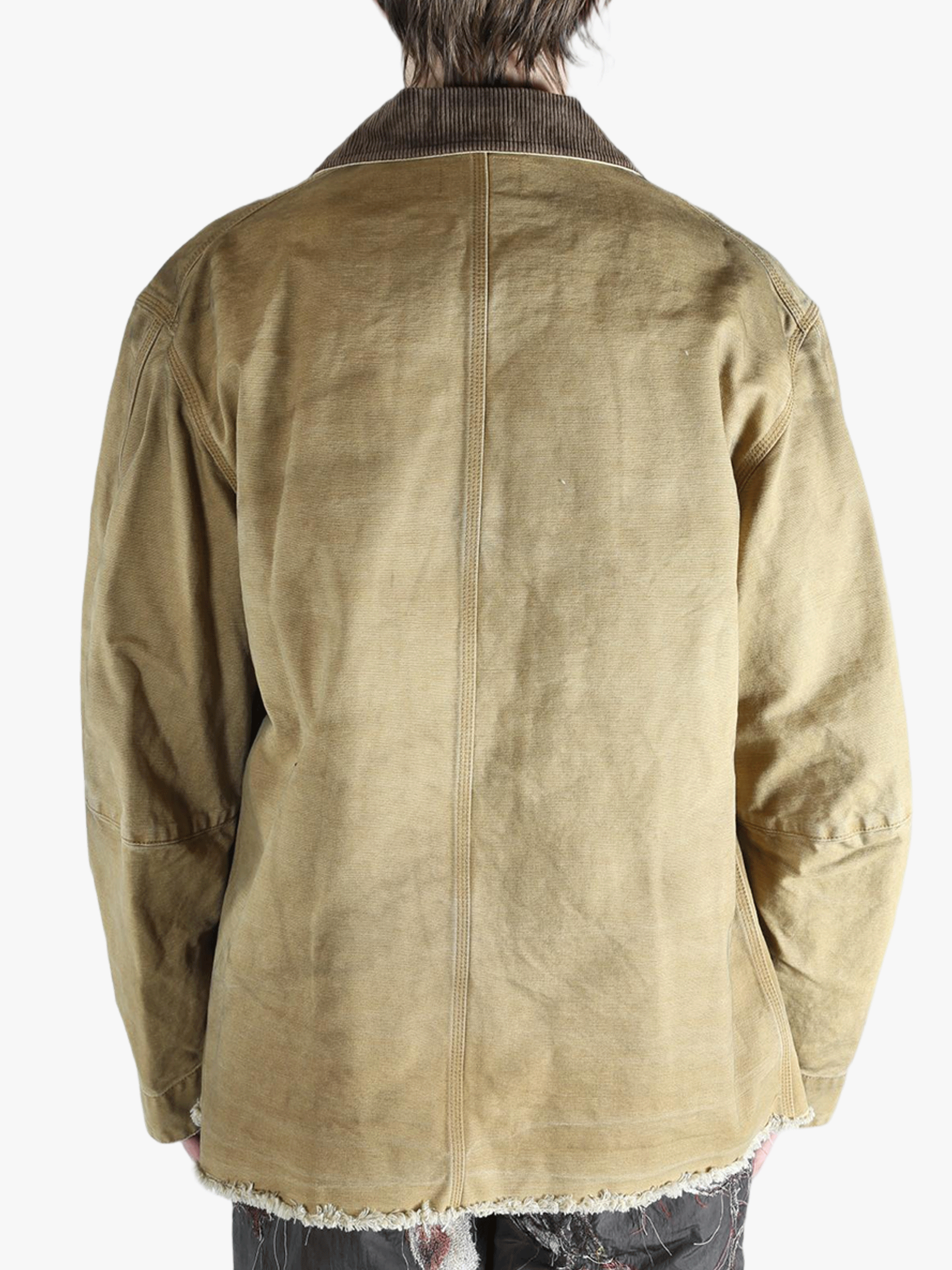 Tan jacket worn by a person, showing the jacket's fit