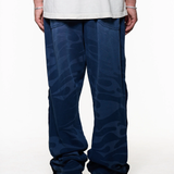 Black pants worn by a person, showing the pants fit