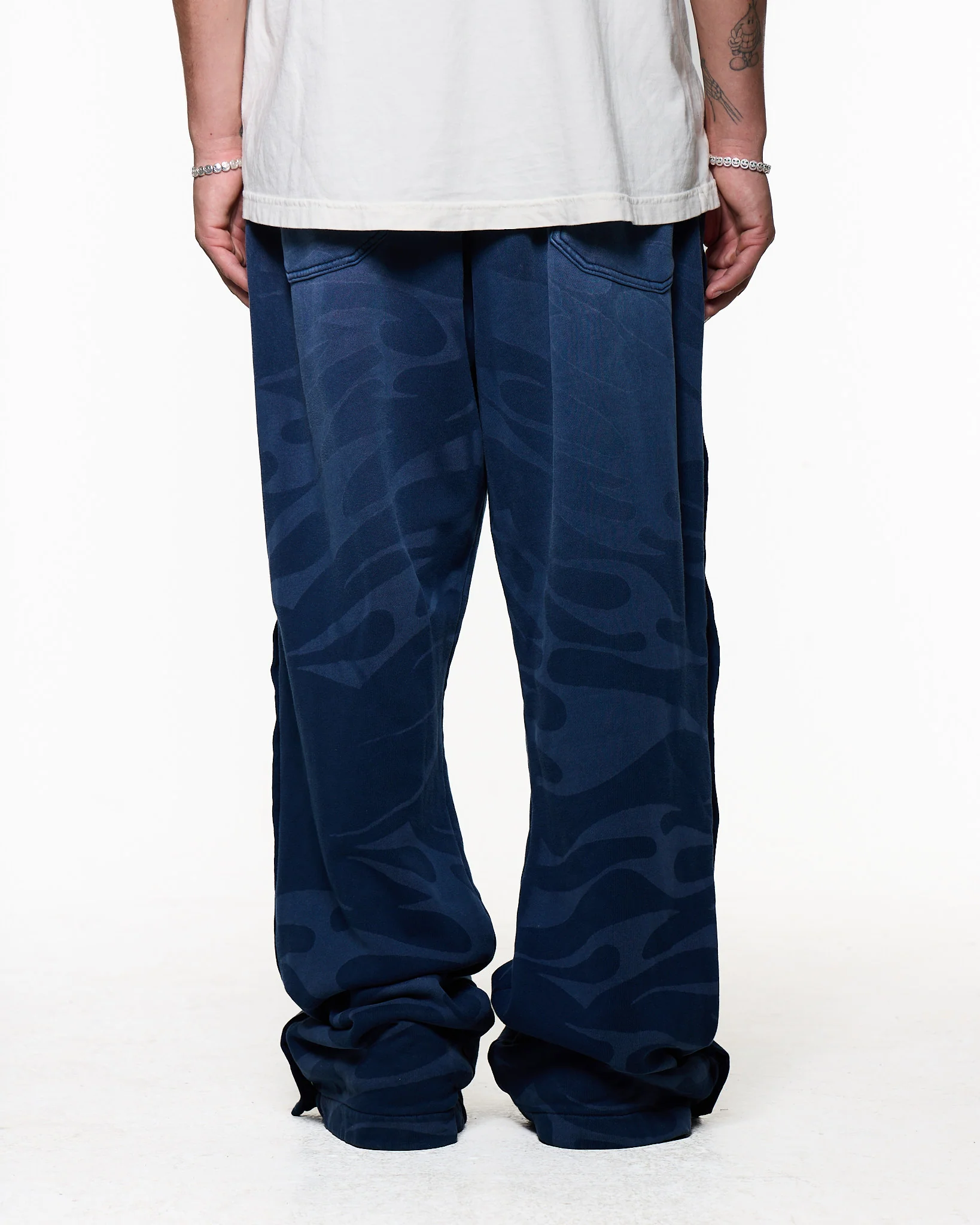 Black pants worn by a person, showing the pants fit