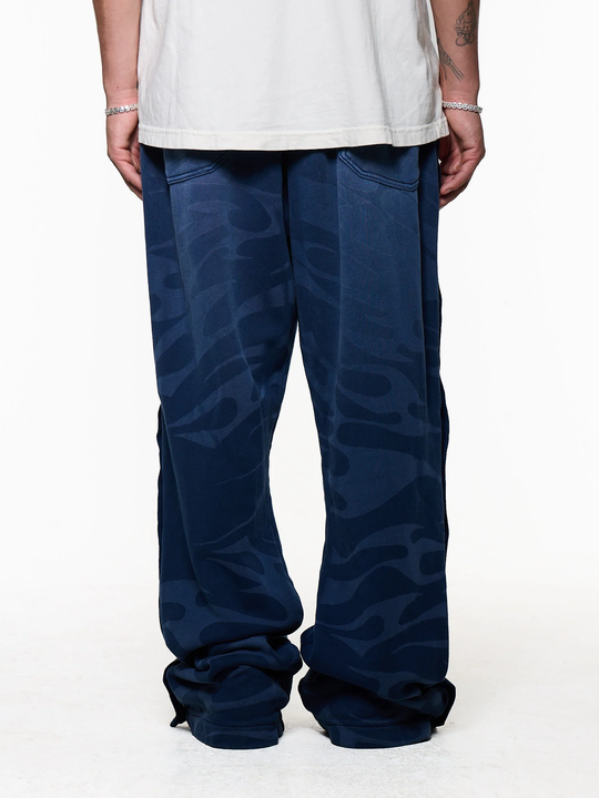 Black pants worn by a person, showing the pants fit