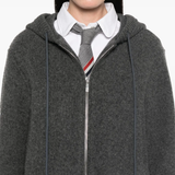 Grey jacket worn by a person, showing the jacket's fit