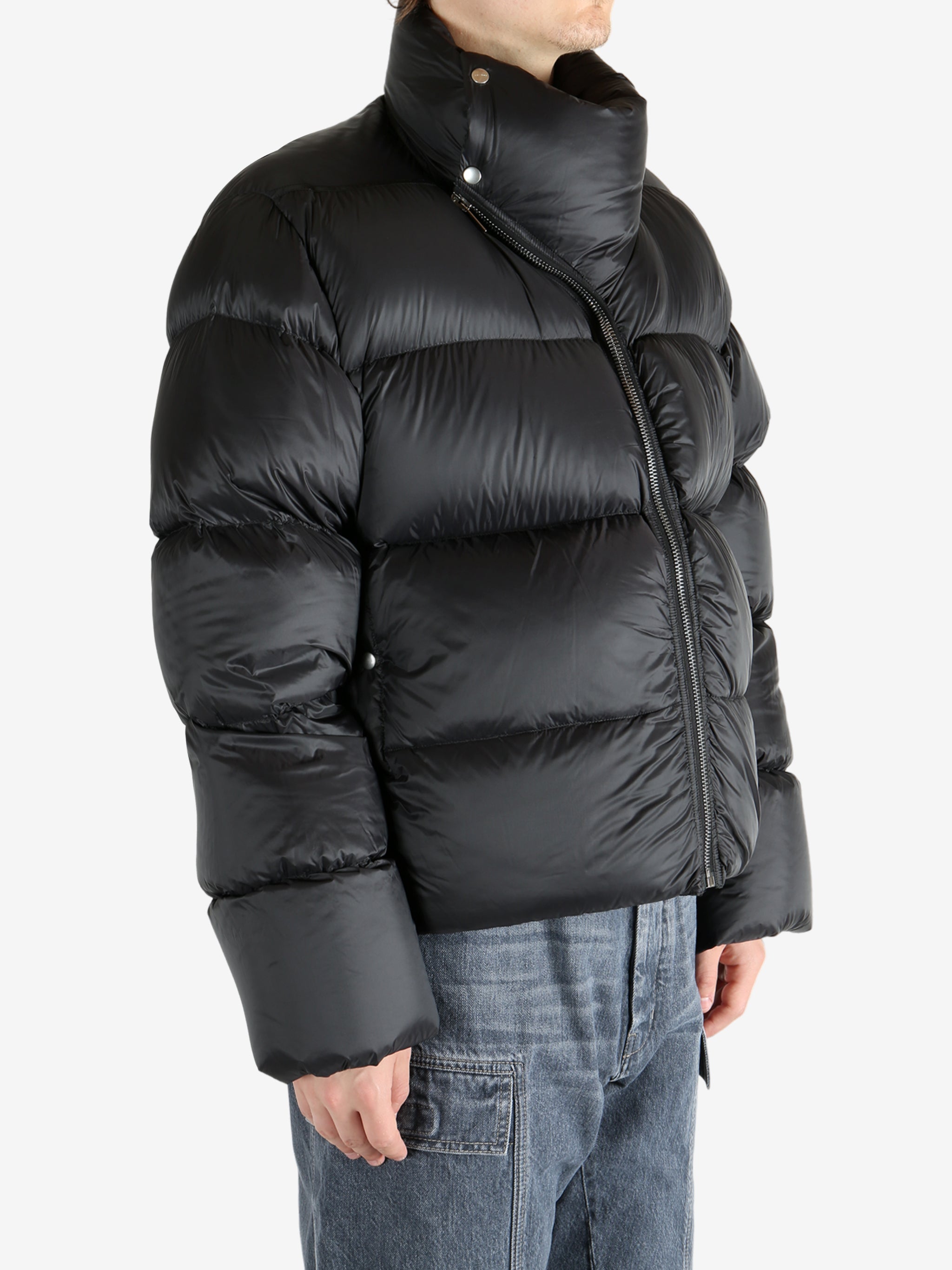 Black coat worn by a person, showing the coat's fit