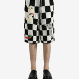 Black shorts worn by a person, showing the shorts’ fit