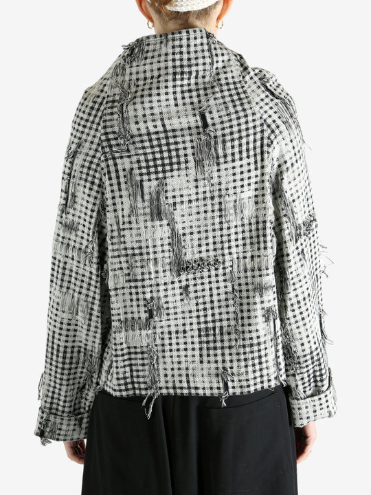 Black jackets worn by a person, showing the jackets fit