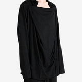 Black shirt worn by a person, showing the shirt fit