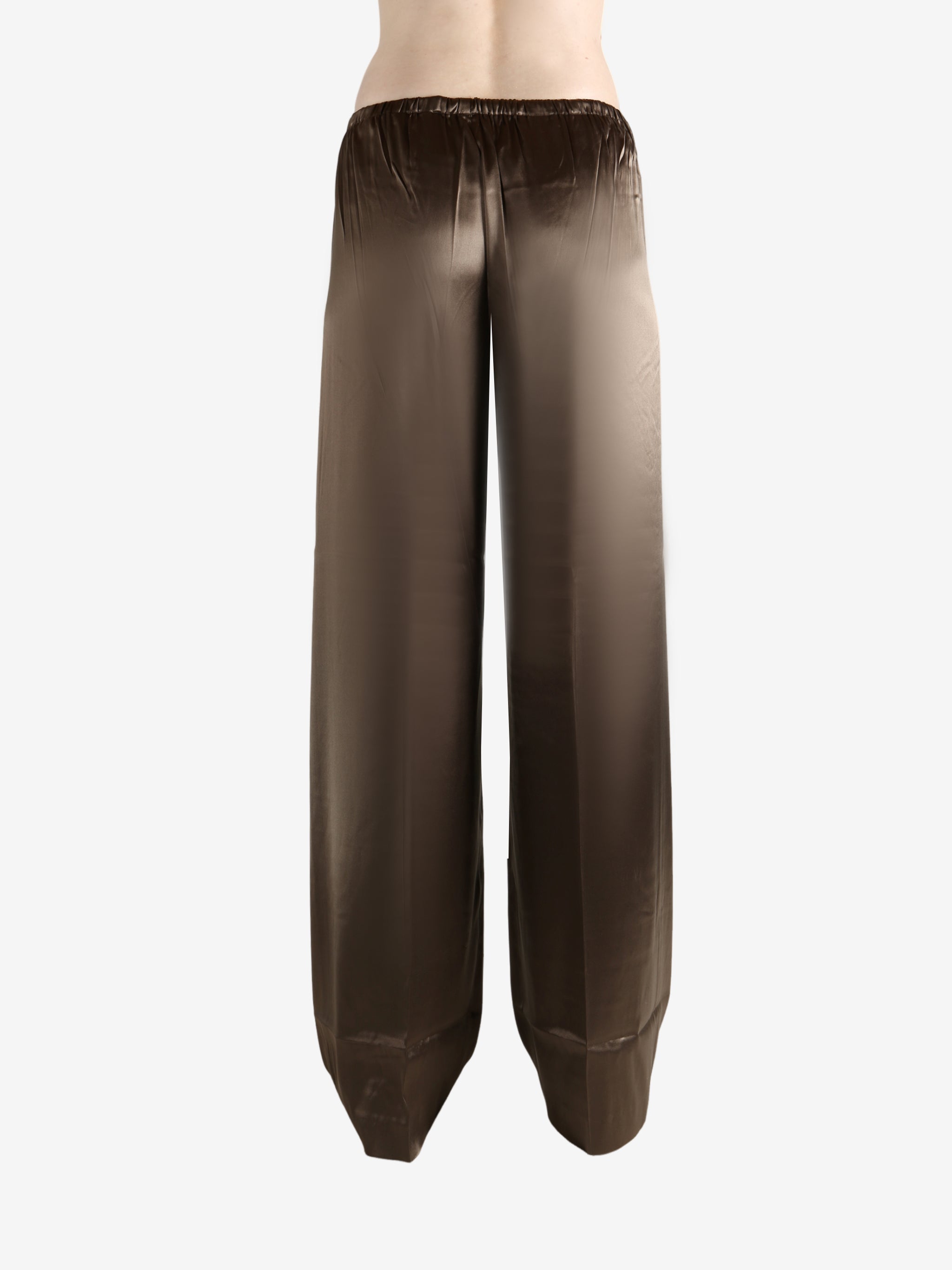 Brown pants worn by a person, showing the pants's fit