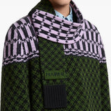 Green scarf worn by a person, showing the scarf fit