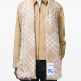 Brown scarf worn by a person, showing the scarf fit