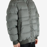 Grey jacket worn by a person, showing the jacket's fit