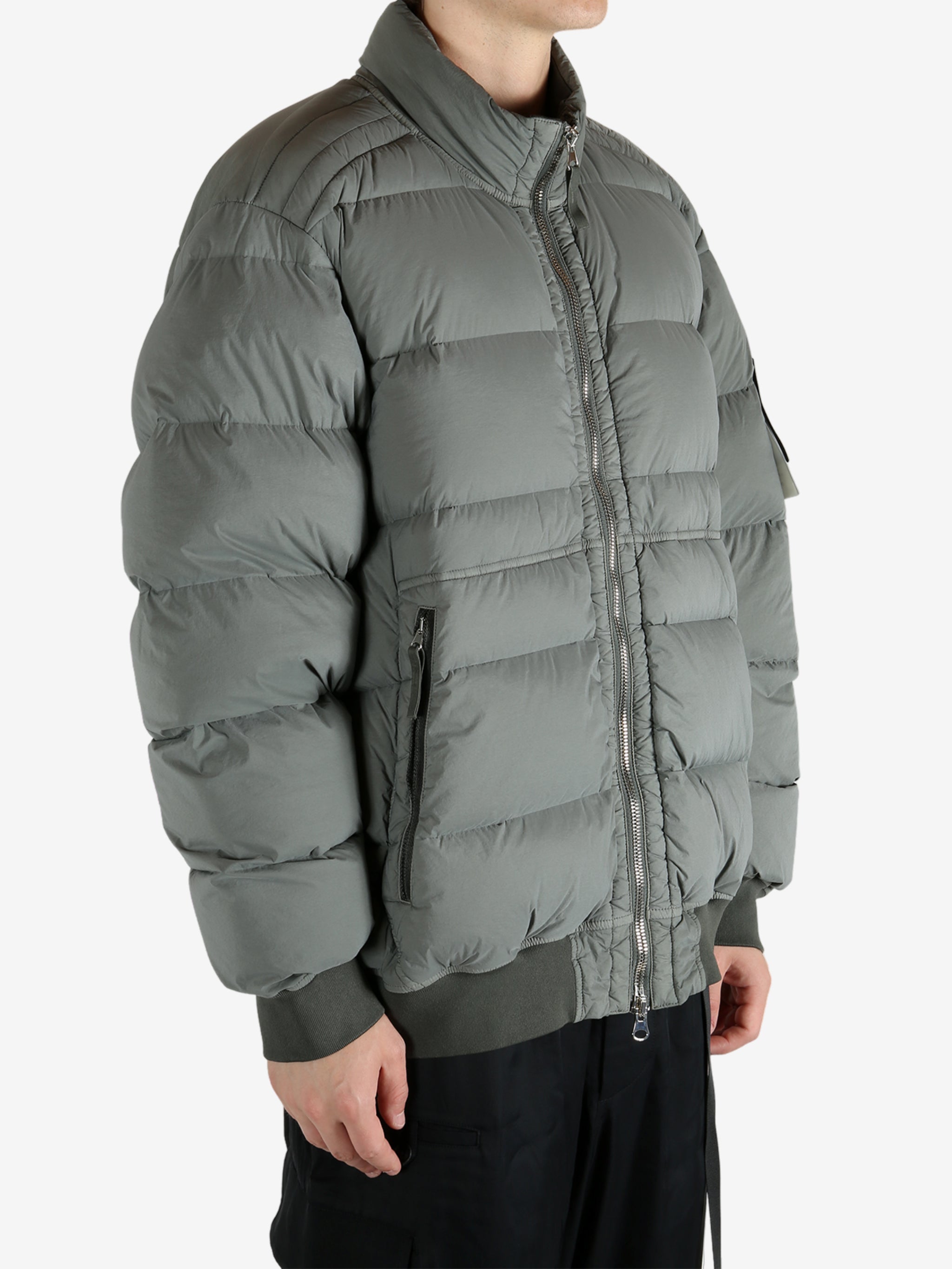 Grey jacket worn by a person, showing the jacket's fit