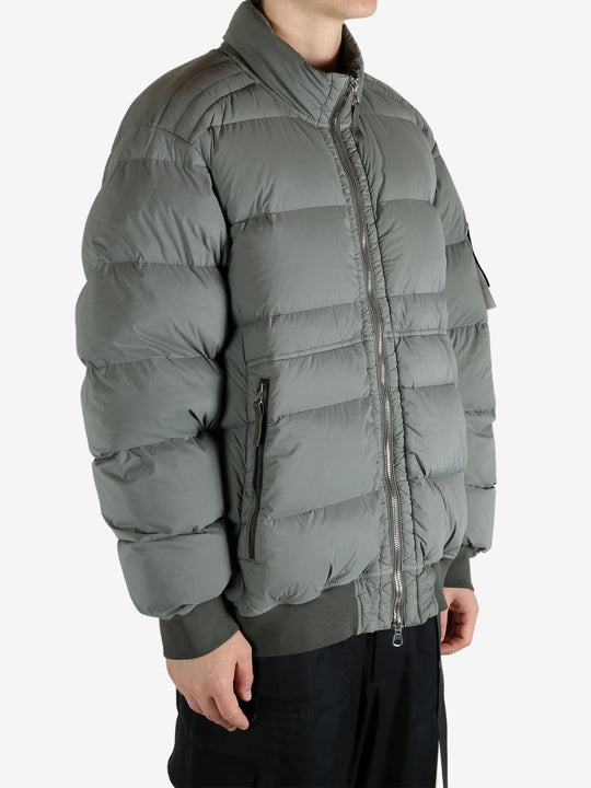 Grey jacket worn by a person, showing the jacket's fit