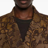 Brown jacket worn by a person, showing the jacket fit