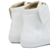 Close up of white sneakers, showing texture of the Calf Leather fabric