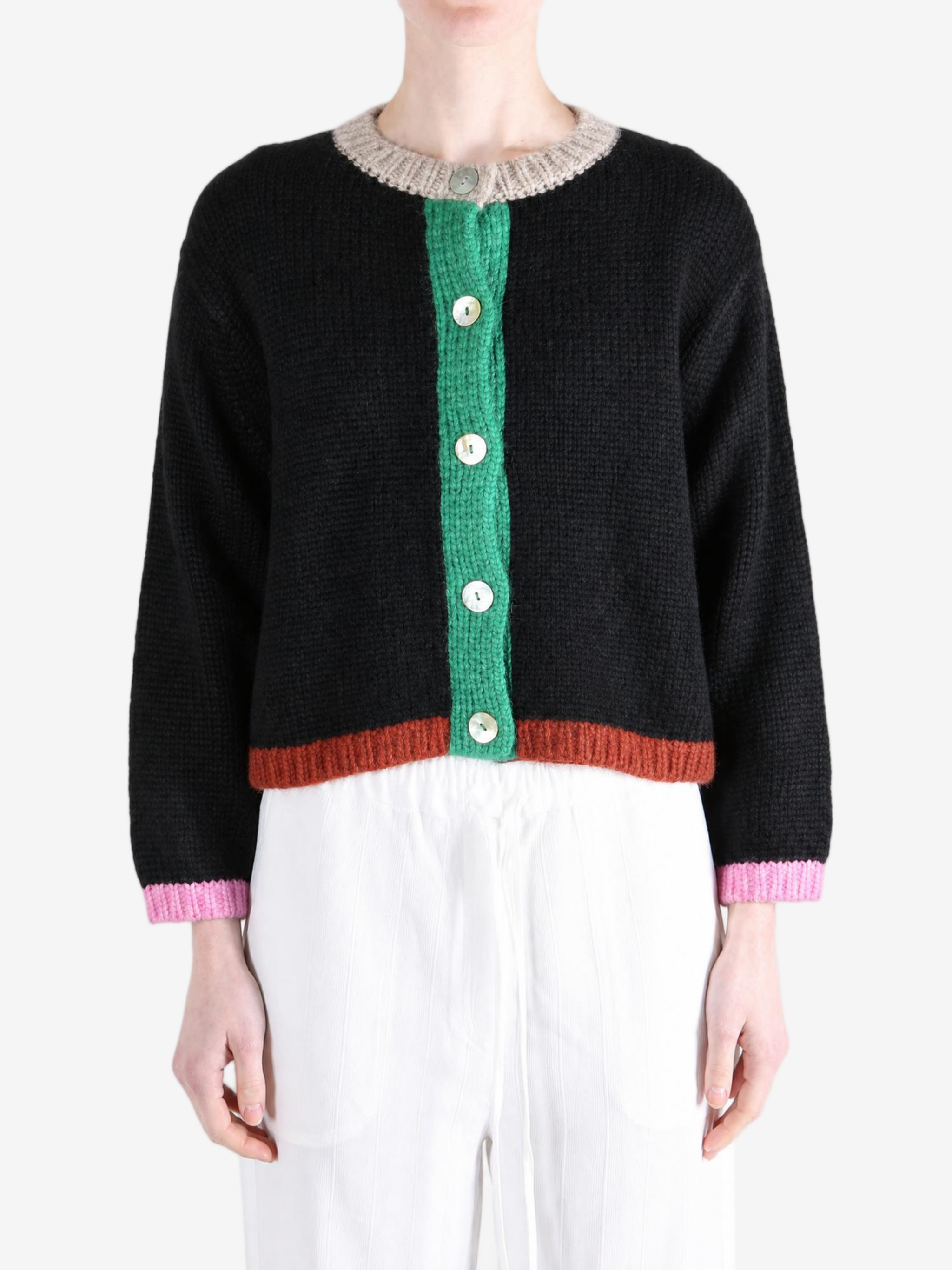 Black knitwear worn by a person, showing the knitwear fit