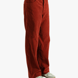 Red pants worn by a person, showing the pants fit