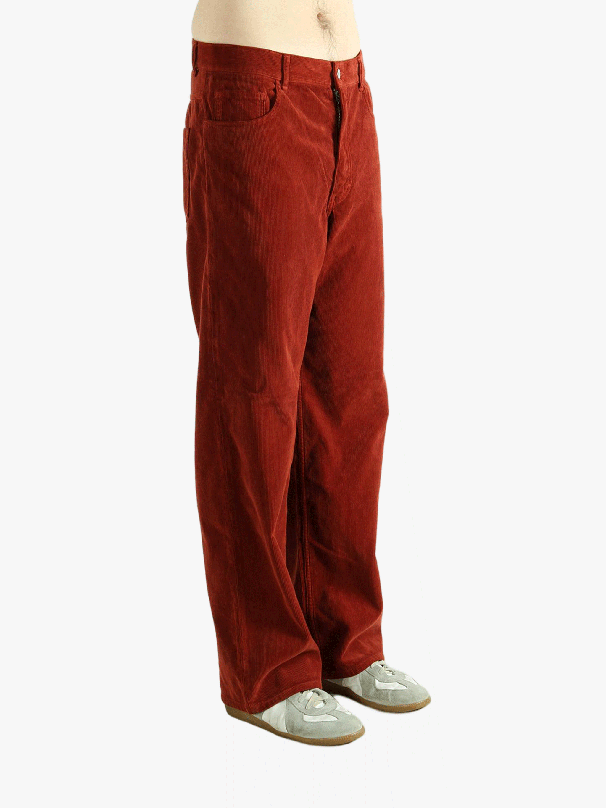 Red pants worn by a person, showing the pants fit