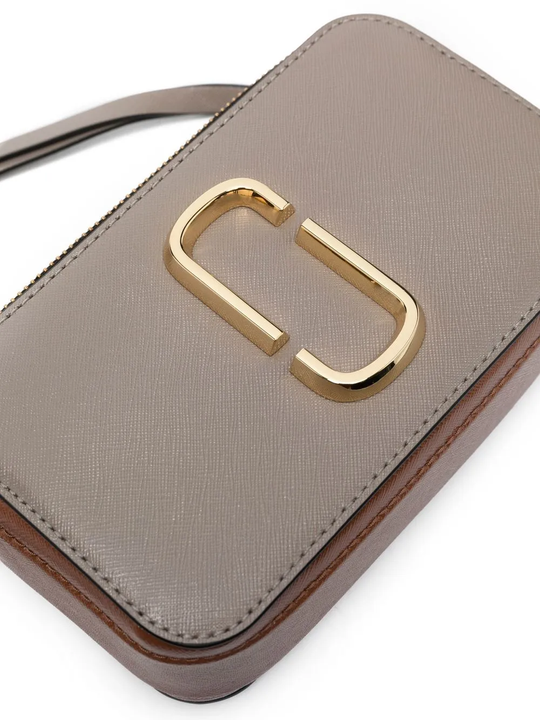 Close up of the grey bag, showing texture of the leather fabric