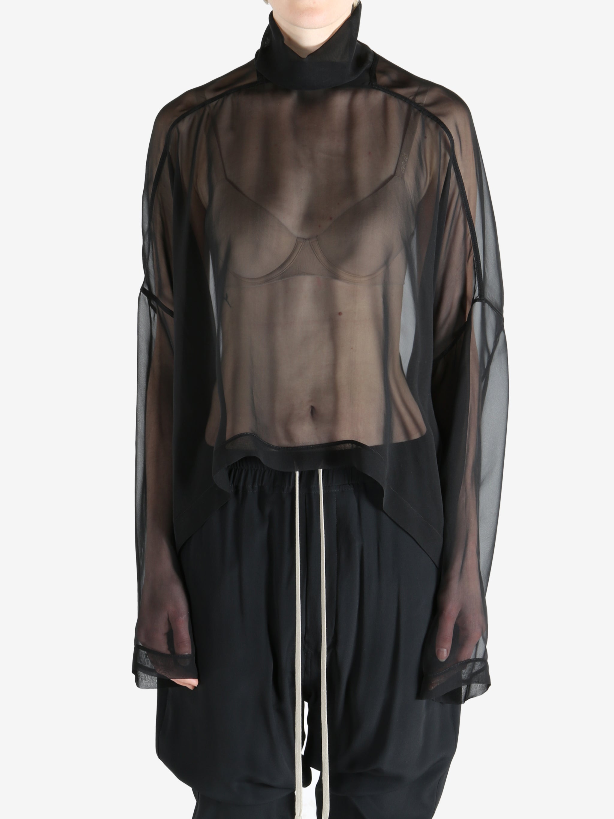 Black top worn by a person, showing the top's fit