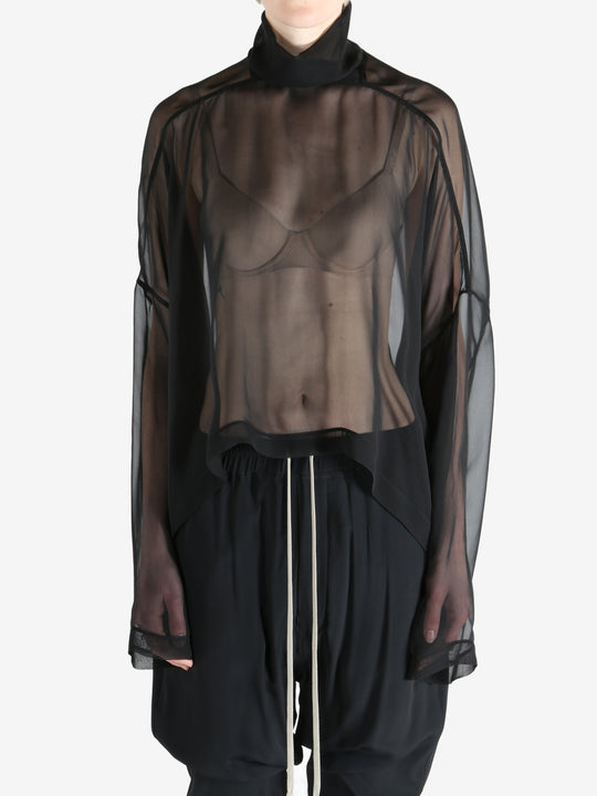 Black top worn by a person, showing the top's fit