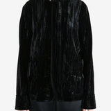 Black jacket worn by a person, showing the jacket's fit