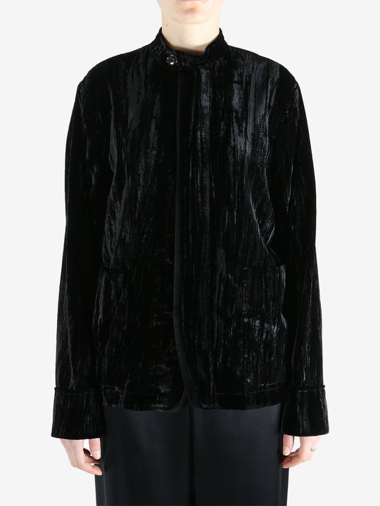 Black jacket worn by a person, showing the jacket's fit