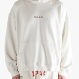 White hoodie worn by a person, showing the hoodie's fit