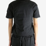 Black t-shirt worn by a person, showing the t-shirt's fit