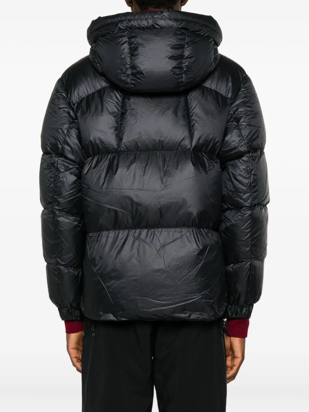 Black parka worn by a person, showing the parka's fit