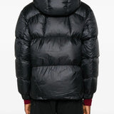 Black parka worn by a person, showing the parka's fit